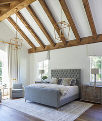 Bedroom with vaulted wood beam ceiling