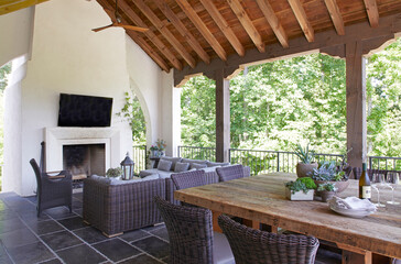 Outdoor room with dining table and fireplace