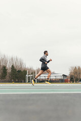 man running on a running track