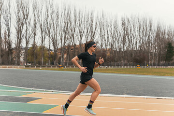 woman running on a running track