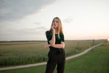 Woman thinking on a country road