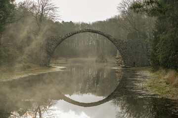 The Rakotz Bridge, also known as the Devil's Bridge, is a remarkable example of romantic garden...