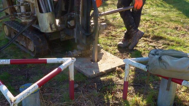 Driving A Drill Probe For Taking Soil Samples With The Small Pile Driver On Caterpillar Drive