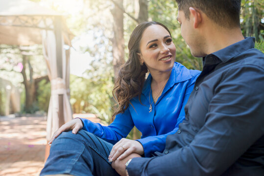 Young latin couple spending time with each other at the park