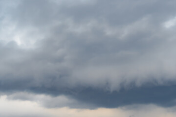 Structure of overcast sky as background. Clouds form texture. Approaching rain front, weather change