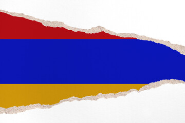 Ripped paper background in colors of national flag. Armenia