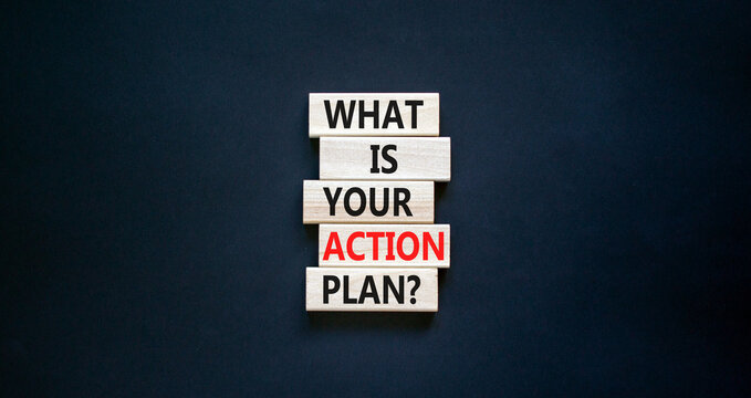 Action plan symbol. Concept words What is your action plan on wooden blocks. Beautiful black table black background. Business What is your action plan concept. Copy space.