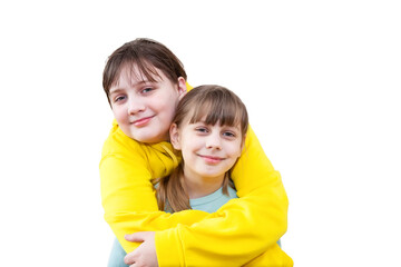 Two sisters hugging and having fun in studio on white background. age difference