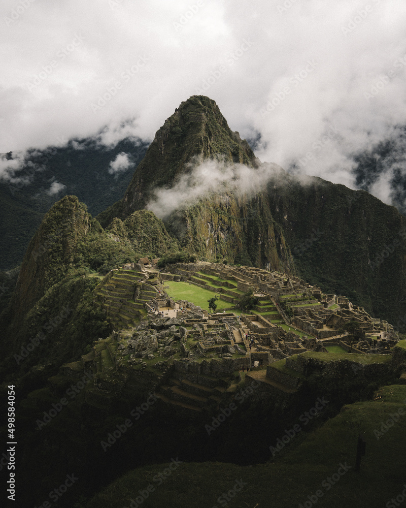 Canvas Prints Bird's eye view of the ancient Machu Picchu citadel with a view of forested mountains and clear sky