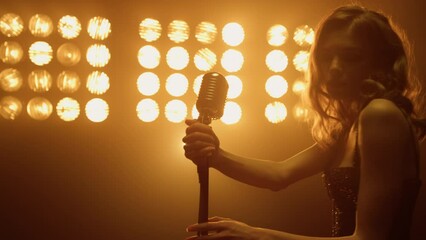 Sexy woman take microphone preparing sing solo on night club stage close up. - Powered by Adobe