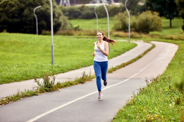 Running in summer in city park by white woman 29 years old.