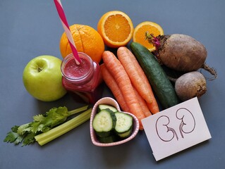 Kidney detox juice in a glass jar with ingredients carrot, cucumber, beet, celery, apple, orange....