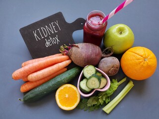 Kidney detox juice in a glass jar with ingredients carrot, cucumber, beet, celery, apple, orange....