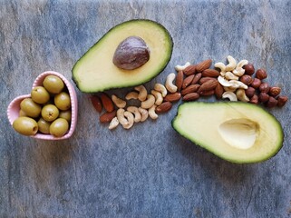Healthy high fat foods. Natural sources of good fats and fatty acids: nuts, almond, walnut,...