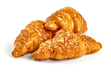 Freshly baked croissants, isolated on white background.