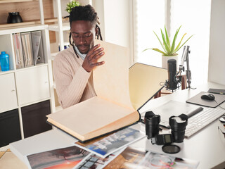Graphic designer/photographer working in home office