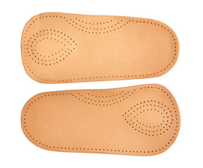 Leather orotopedic leather shoe insoles isolated on white background close-up