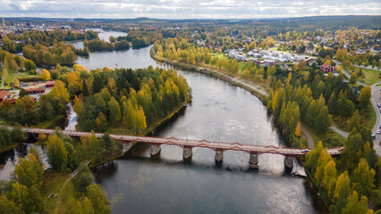 Aerial view of the Lejonstromsbron wooden bridge in Skelleftea, Sweden, crossing the Skellefte River