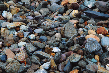Closeup shot of the colorful gravels on the ground during daytime