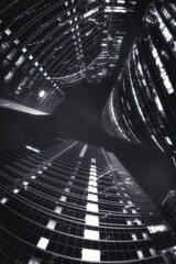 Gray scale of low angle shot of tower buildings in Moscow-city during night