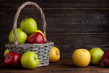 Colorful ripe apple fruits in basket