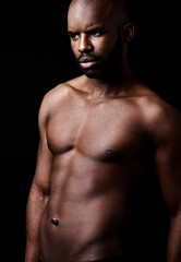 Fototapeta na wymiar Dedication to strength. Studio shot of a muscular man looking serious.