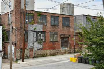 Fototapeta na wymiar Derelict Brick Warehouse in Alley in the United States
