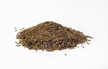 Cumin seeds in a pile isolated on white background