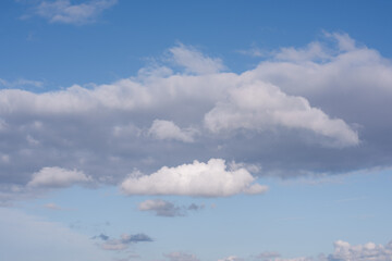 Fluffy clouds in the blue sky for replacement.