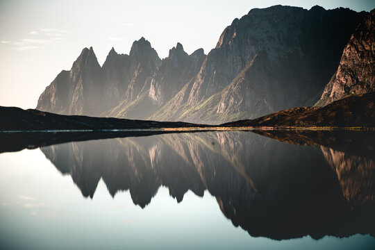 Scenic view of the Devil's Teeth mountains against blue sky, Tungeneset, Okshornan, Senja, Norway