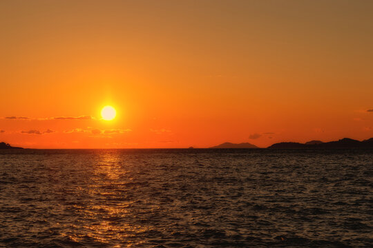 The sun sets over the horizon in the Adriatic Sea