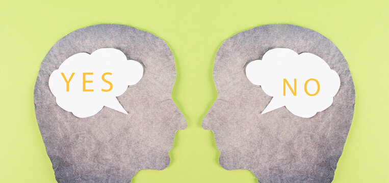 Head silhouettes with speech bubbles, words yes and no, communication between people, business and education concept, minimalism, asking questions, looking for an answer