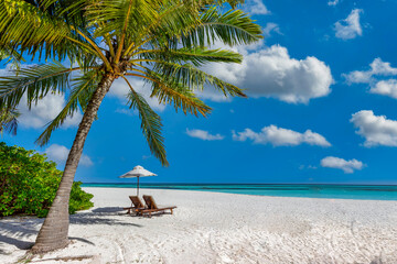 Beautiful tropical island scenery, two sun beds, loungers, umbrella under palm tree. White sand,...