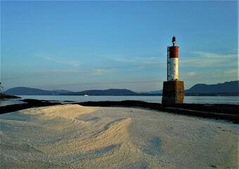 Obraz premium lighthouse on the shore of the sea