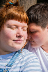 Lesbian couple embracing.