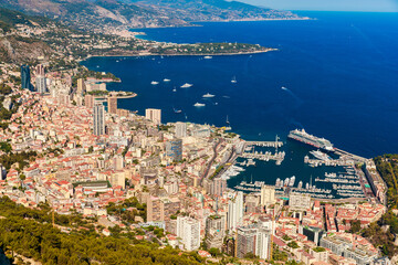 Aerial view of port Hercules of Monaco at sunset, Monte-Carlo, huge cruise ship is moored in...