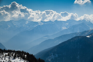 Naklejka na ściany i meble Beautiful sunny day at Pejo Ski Resort. Amazing top view to Val di Sole valley, Italy. Europe.
