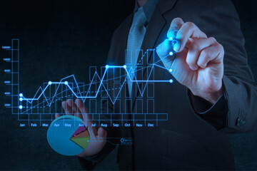 Man with graphs showing his business planning