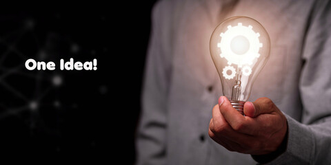 a man with bulb and gear icon showing idea sign