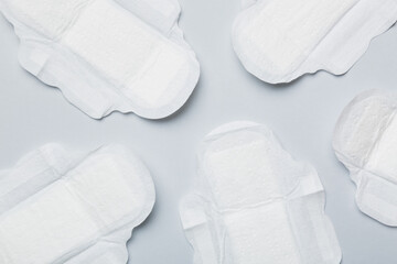 Women hygiene products or sanitary pad on colored background. Pastel color. Closeup. Empty place for text. Female daily hygiene