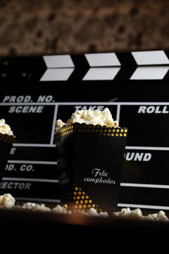 clapperboard for film shooting, with popcorn you feel more like going to the cinema