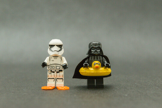 Minifigure of Darth Vader and stormtrooper on vacation wearing a duck float and fins