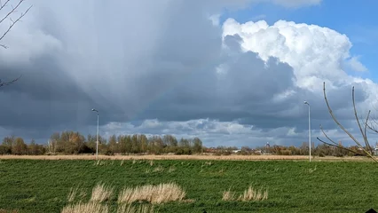 Fotobehang Rainbow clouds over the field © Erfan
