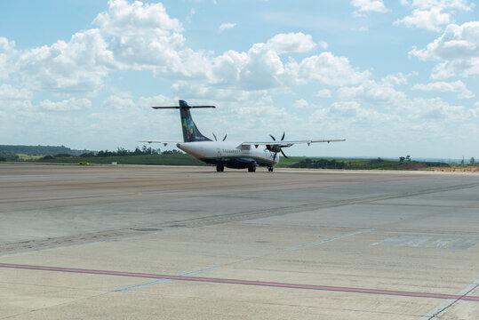 Back View Of ATR-72 Model Turboprop Passenger Plane Parking At The Airport