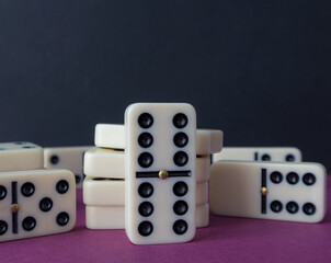 Classic domino chips on a gray background. The concept of free time. Game.