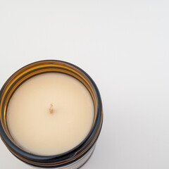Top view of a cream candle on white background