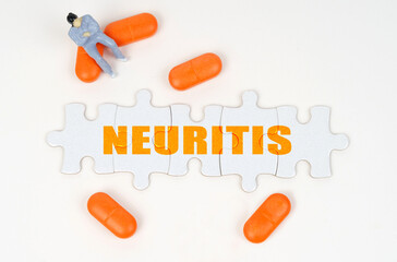 On the white surface of the tablet, a miniature human figure and puzzles with the inscription - NEURITIS