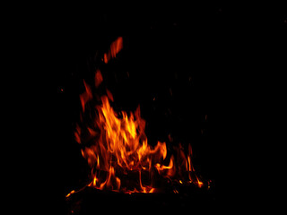 Abstract flame of fire from a campfire on a black background