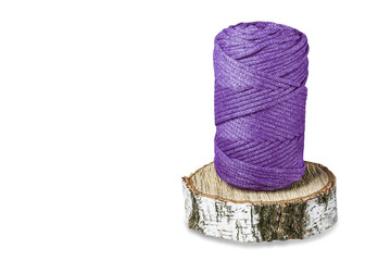 A skein of lilac cotton cord, consisting of threads twisted together.