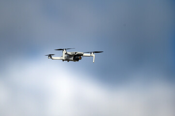 Unmanned aerial vehicle close-up. A new gadget for a quadrocopter against the sky